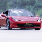 a Ferrari 457 driving around a race track for 6th Gear Experience